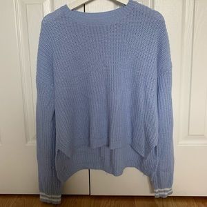 a blue sweater